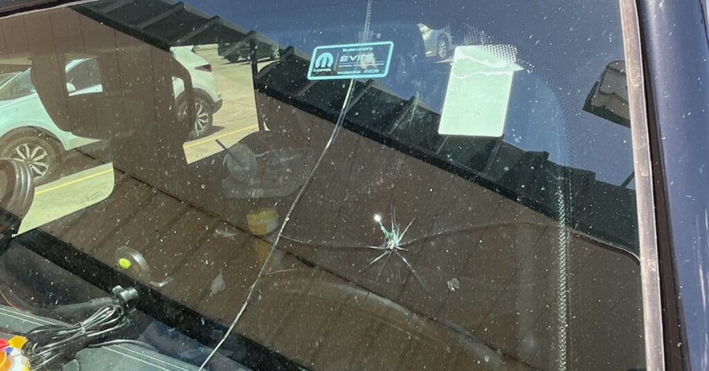 Windshield crack spreading across front glass, showing how temperature cracked windshield damage expands and the risks of driving with cracked windshield conditions